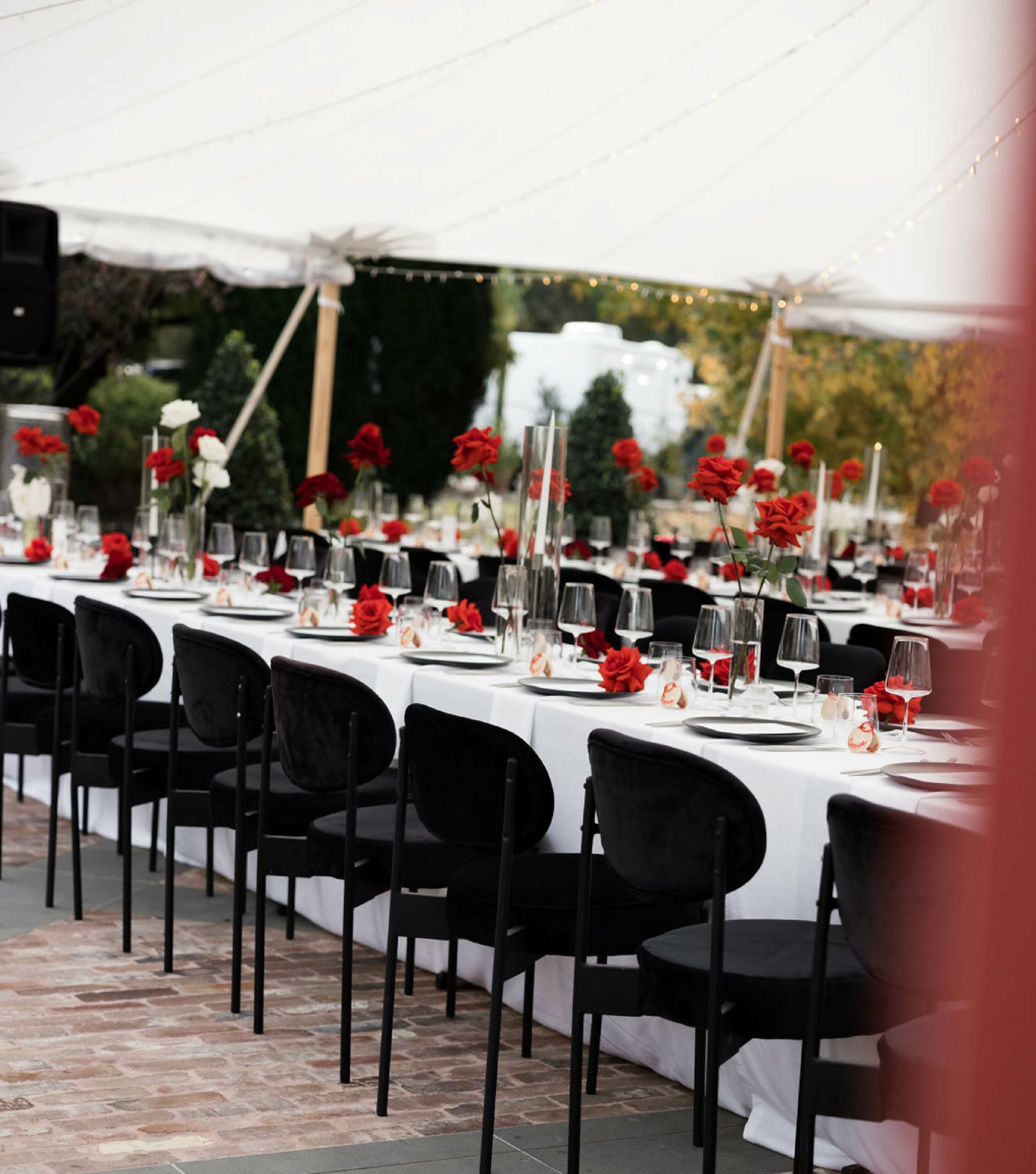 White Table with Black Chairs Styled for a Wedding