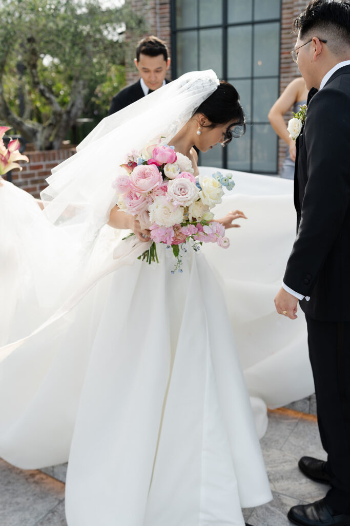 Bride holding wedding bouquet by Gwen Floral Co